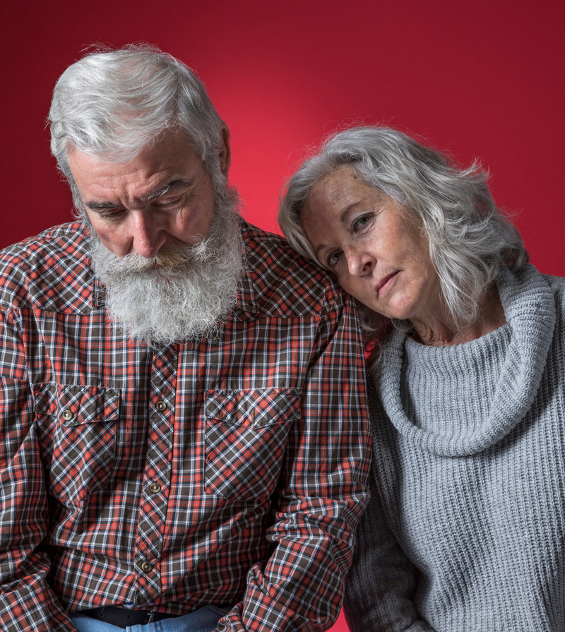 depressed-senior-couple-against-colored-background (1).jpg