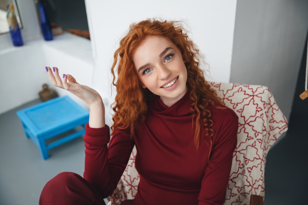portrait-smiling-young-redheaded-woman.jpg